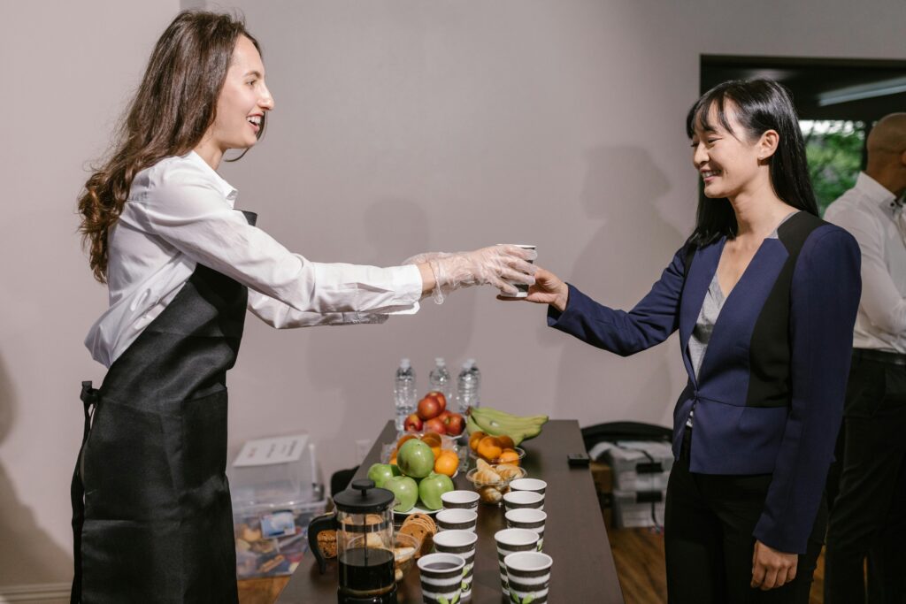How Event Planning Companies in Singapore Are Shaping the Future of Hybrid Events,Lady Offering Drink