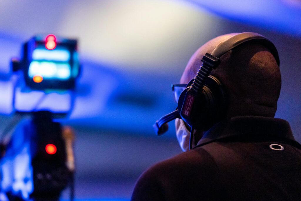 Conference Event Planning Checklist, Man wearing glasses & headset